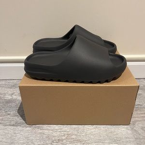 Adidas Yeezy Slides in Onyx. Size 9. BRAND NEW WITH TAGS. ORIGINAL PACKAGING.